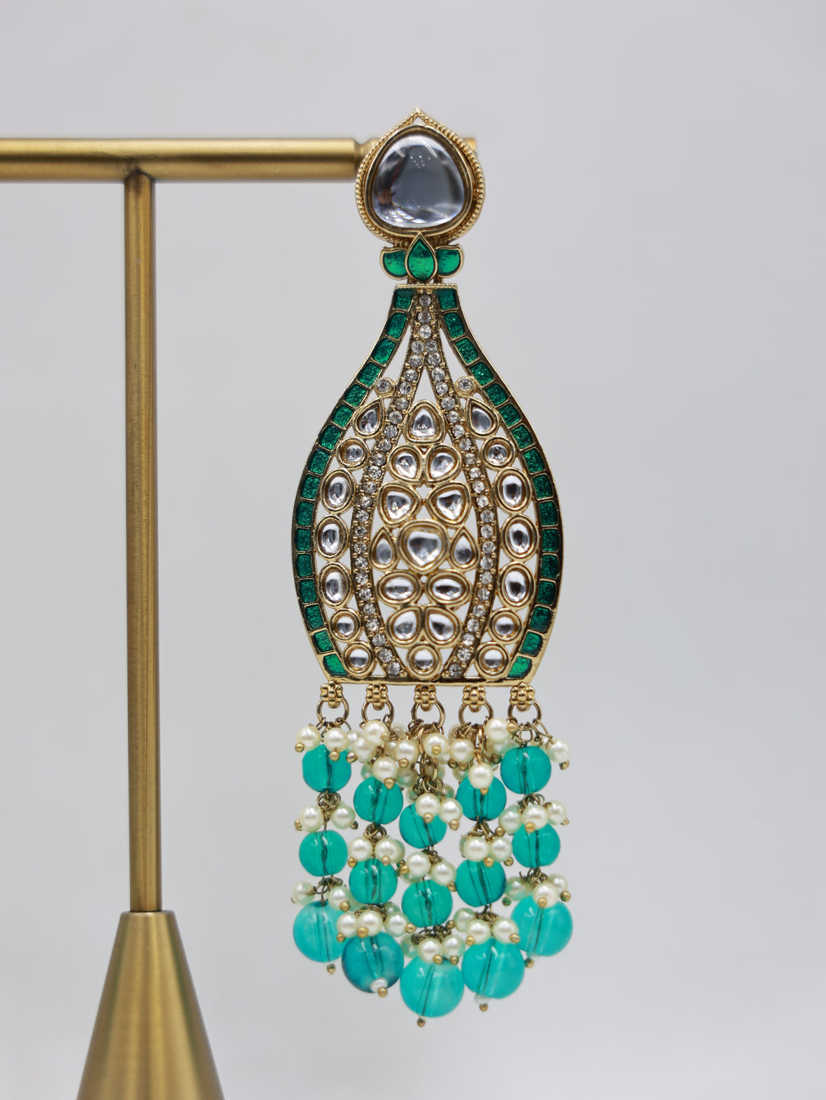 Detailed close-up: teal and pearl bridal earrings