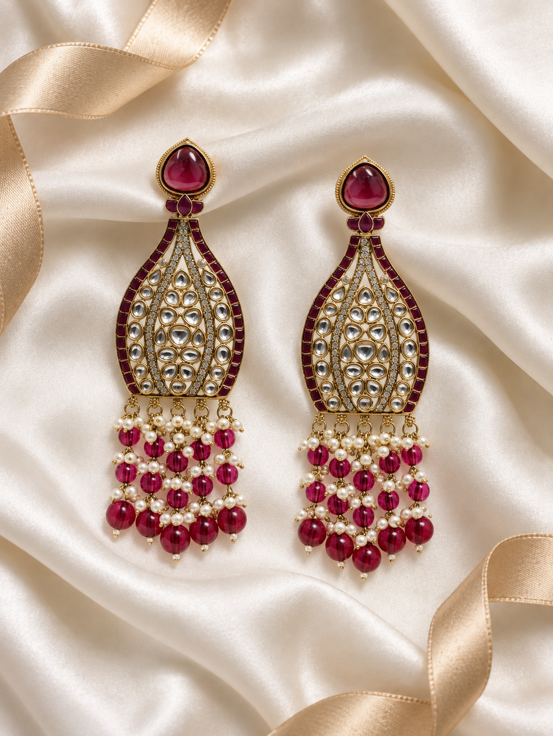 Editorial product-content photo: magenta and pearl bridal earrings