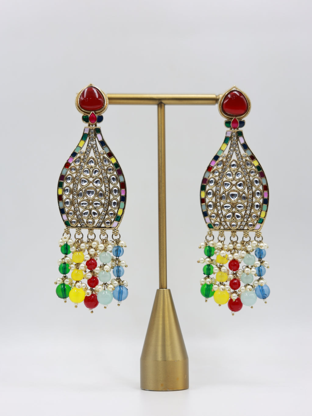 Product displayed on stand: multicolour bridal earrings