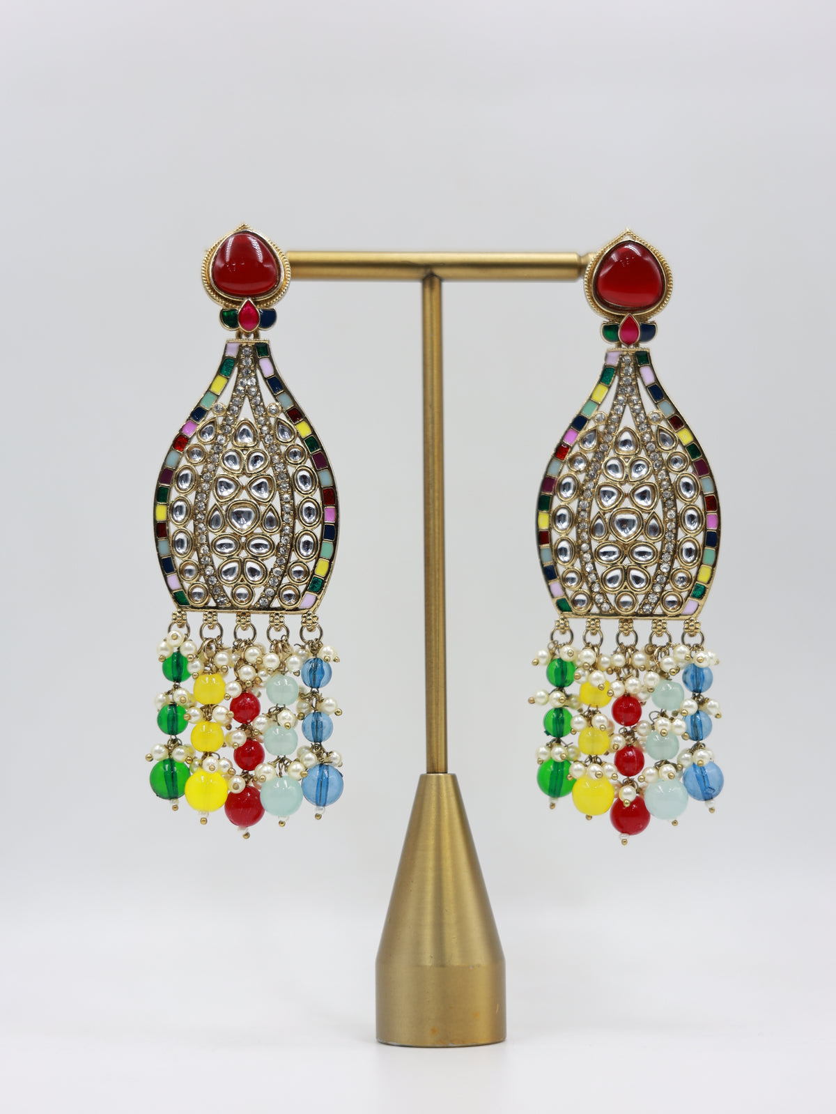 Product displayed on stand: multicolour bridal earrings