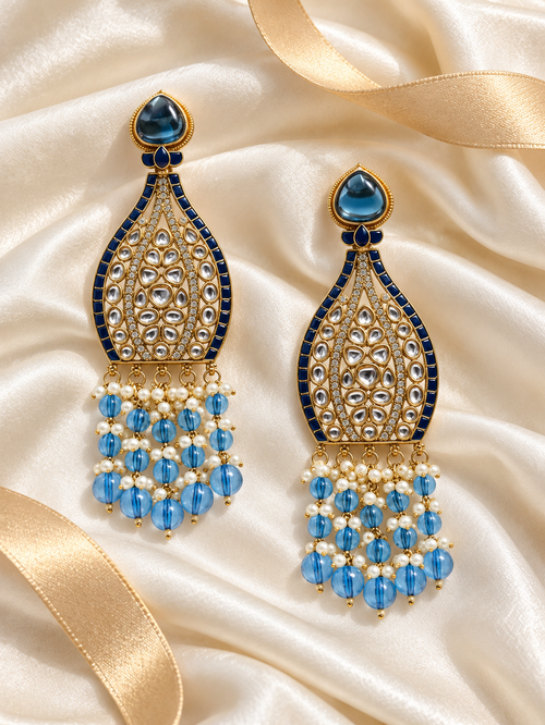 Editorial product-content photo: blue and pearl bridal earrings
