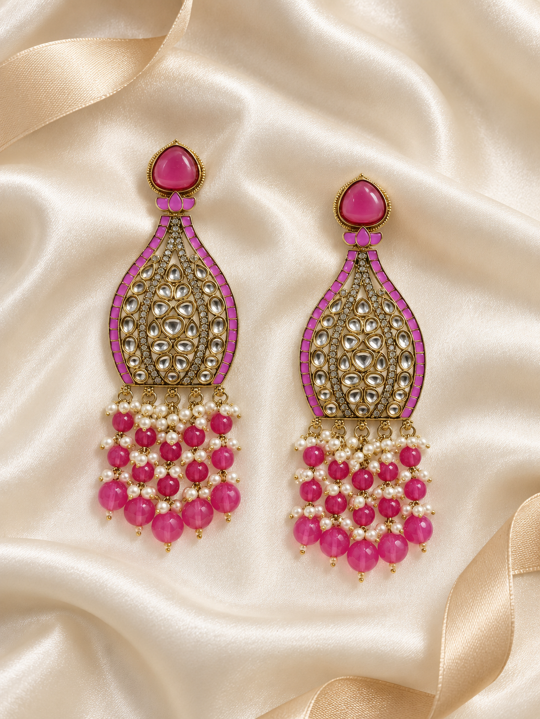 Editorial product-content photo: pink and pearl bridal earrings