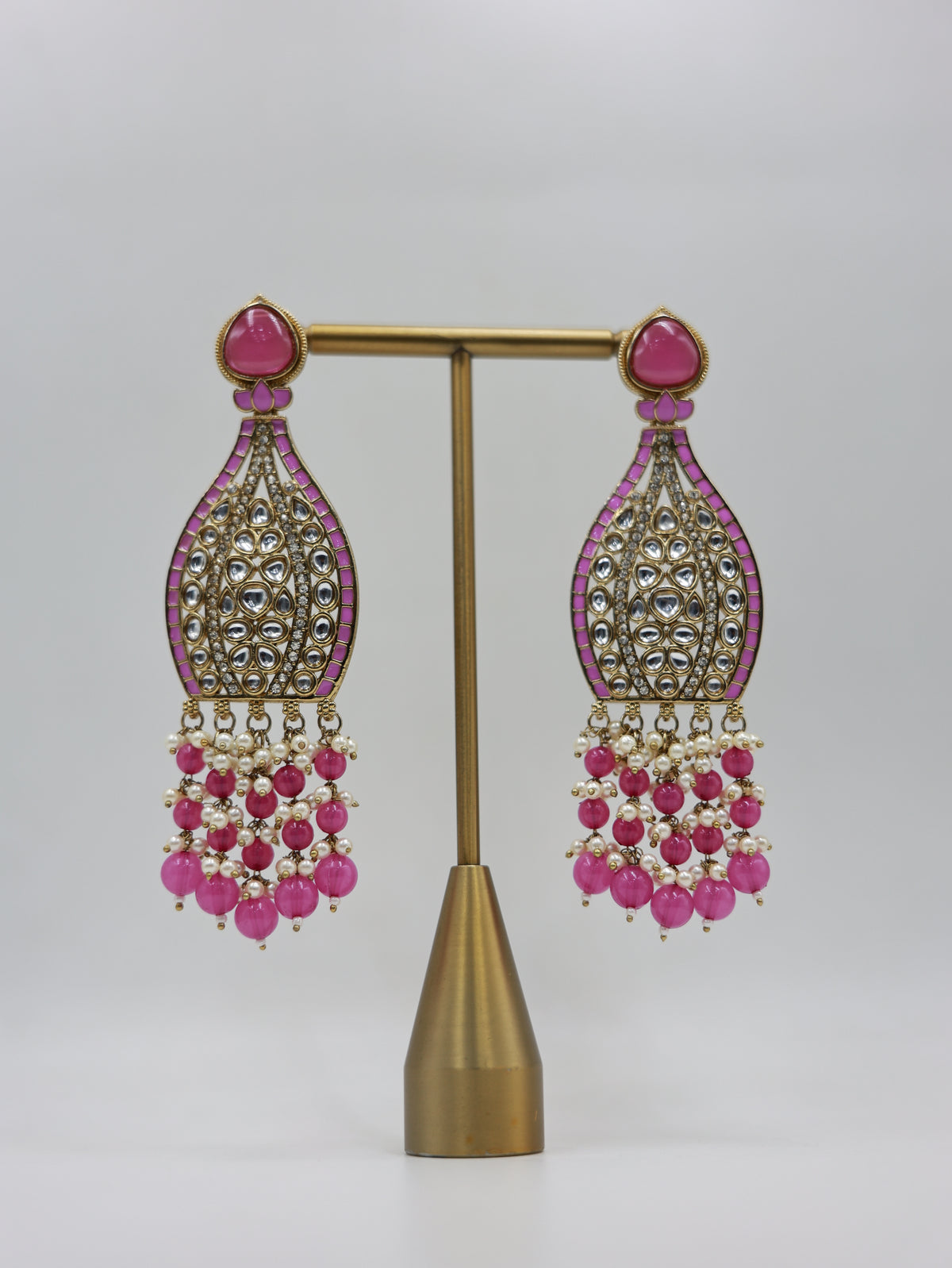 Product displayed on stand: pink and pearl bridal earrings