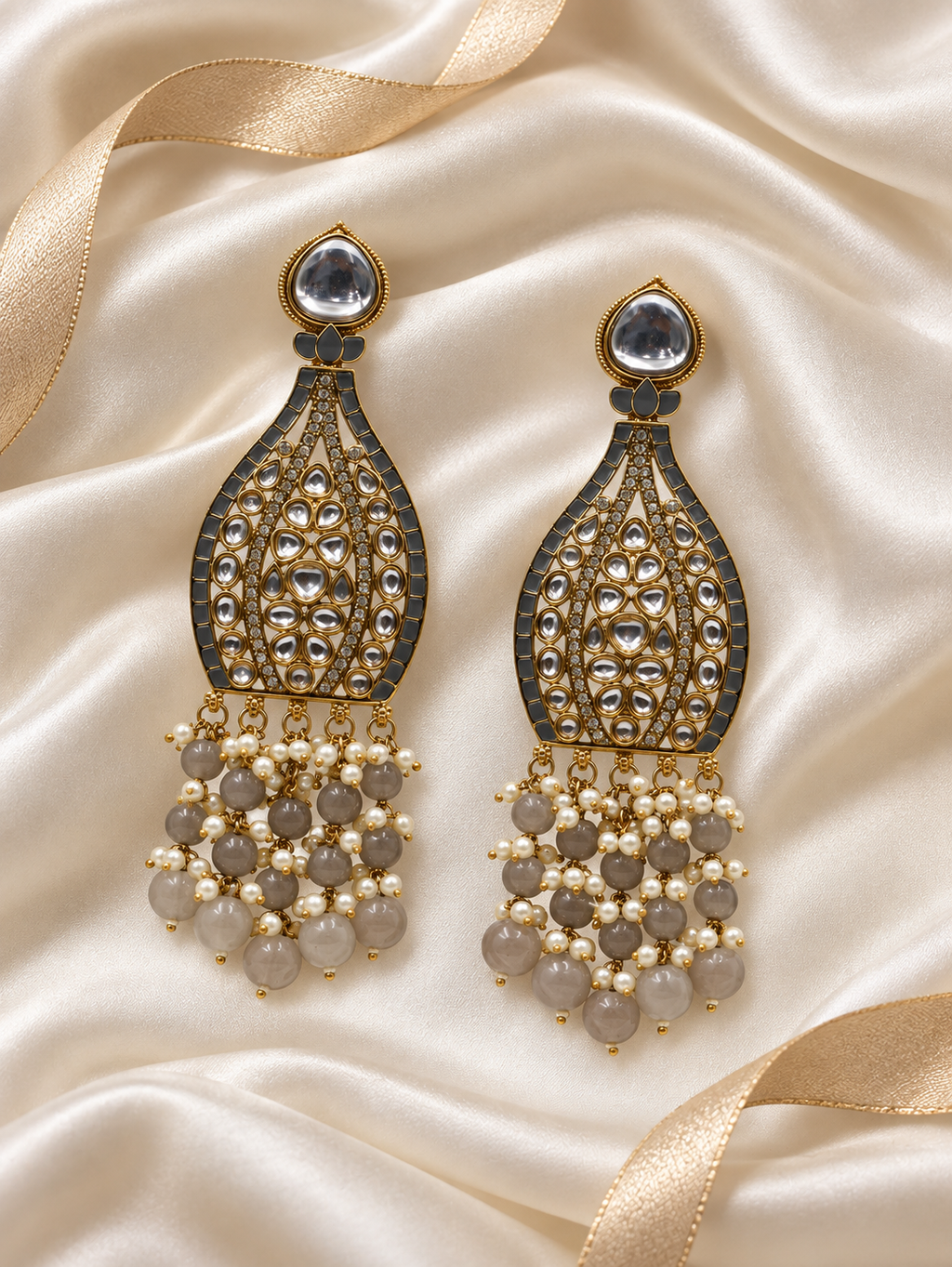 Editorial product-content photo: smoky grey and pearl bridal earrings