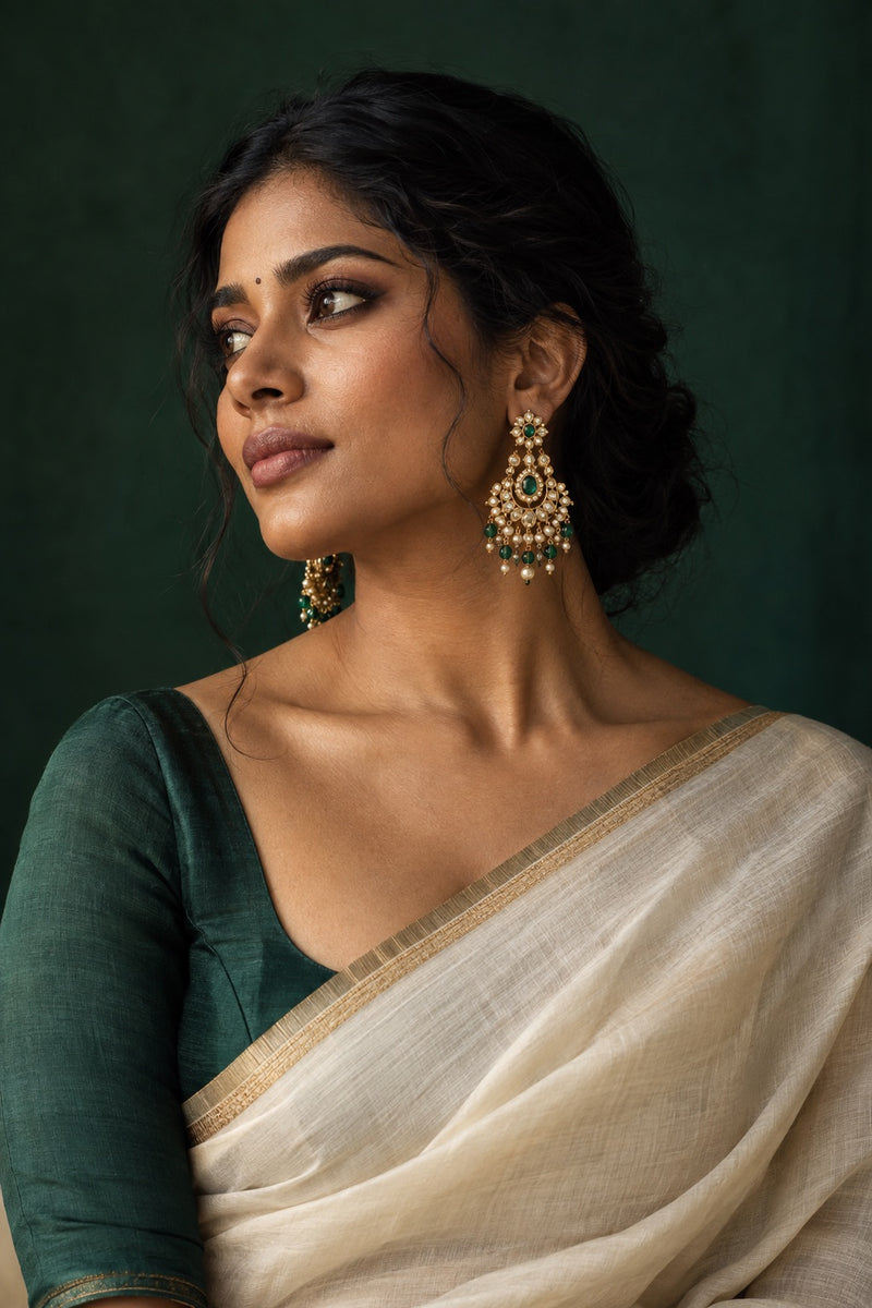 Earrings styling with an ivory sari